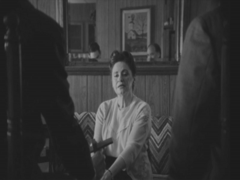 Still from the film on the television